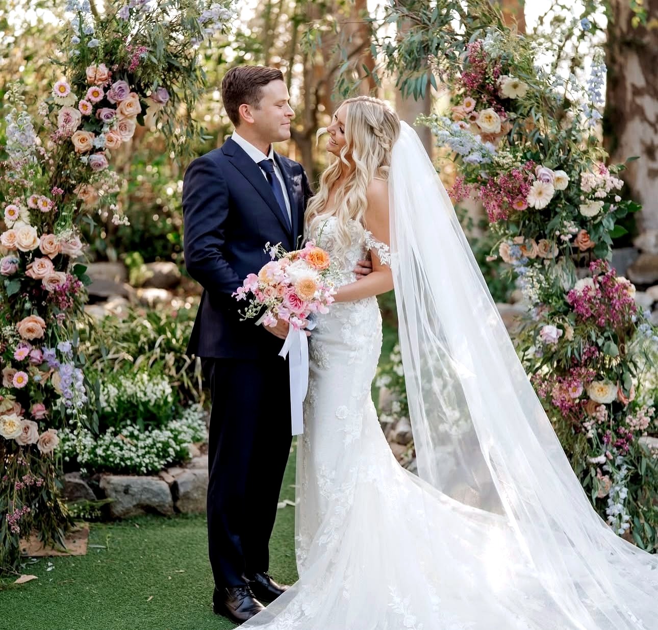 Wedding couple with florals